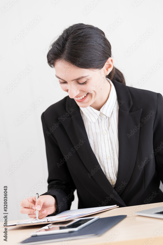 A businesswoman has working with concentrate and happiness. A businesswoman has working with concentrate and happiness.