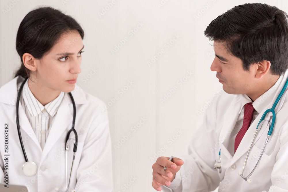 Two doctors have working together with happiness in the hospital. Two doctors have working together with happiness in the hospital.