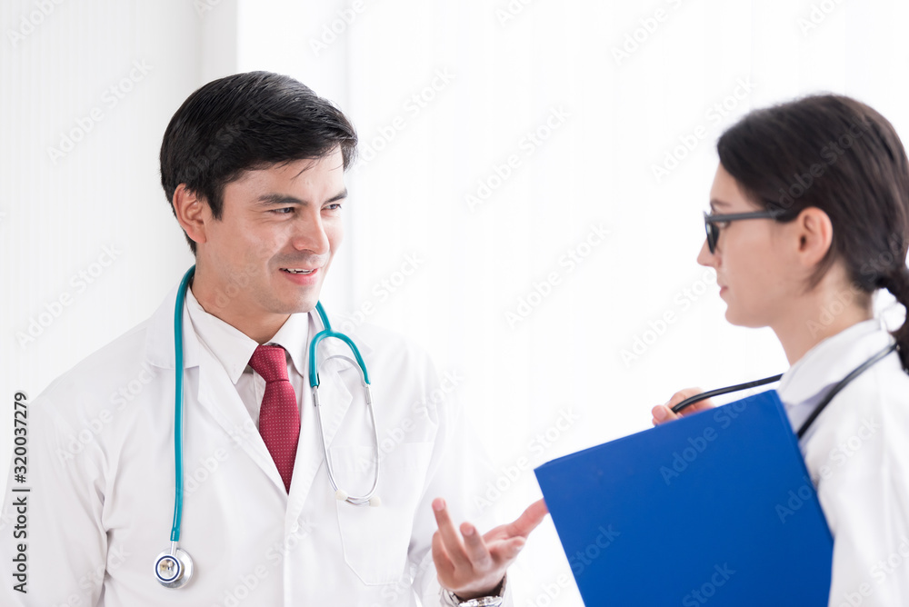 Two doctors have working together with happiness in the hospital. Two doctors have working together with happiness in the hospital.
