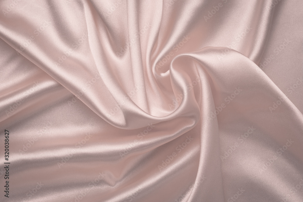 Abstract silk background. Soft pink shiny fabric. Delicate rose textile texture. Satin folds, waves pattern. Pastel silky backdrop with curves, luxury fashion. Abstract silk background. Soft pink shiny fabric. Delicate rose textile texture. Satin folds, waves pattern. Pastel silky backdrop with curves, luxury fashion.