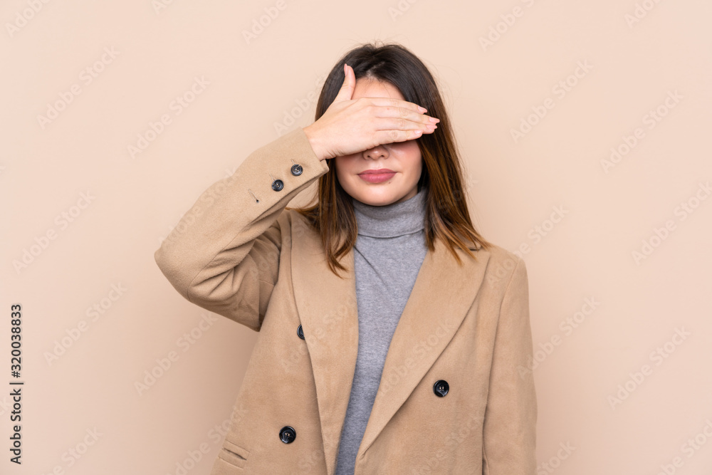 Young woman over isolated background covering eyes by hands Young woman over isolated background covering eyes by hands