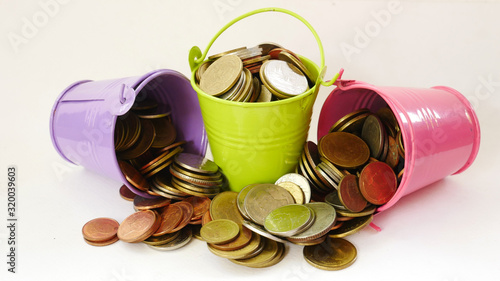 Wallpaper Mural coins bucket on white background concept save money Torontodigital.ca