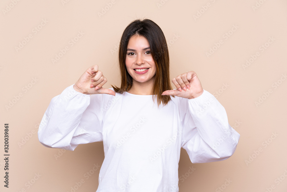 Young woman over isolated background proud and self-satisfied Young woman over isolated background proud and self-satisfied