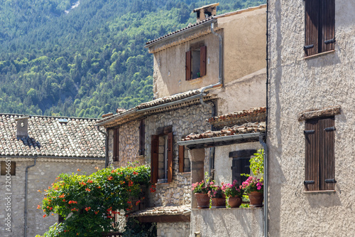 A cozy corner with flowers in the old historical center of Annot, Provence, France