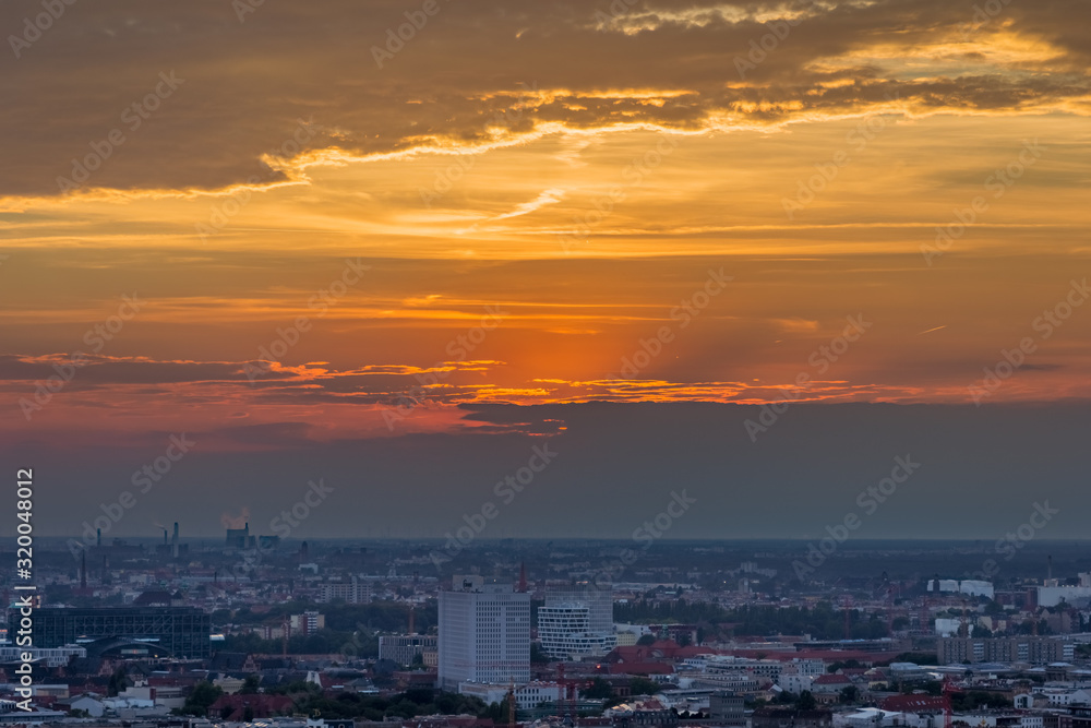 AERIAL VIEW OF CITYSCAPE AT SUNSET