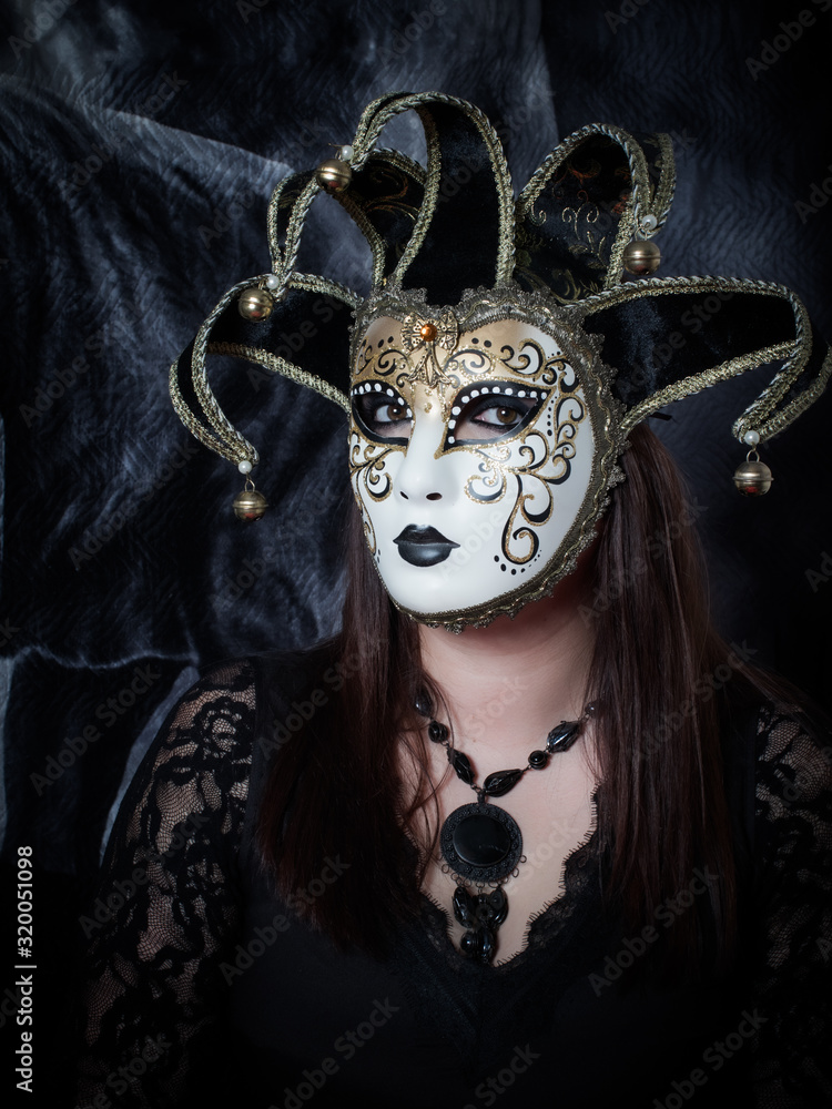 a magical sorceress looks through a mask. magic, divination and witchcraft