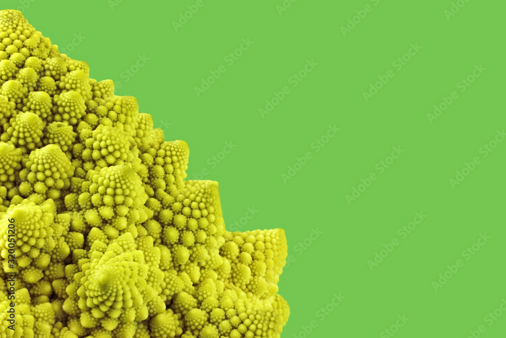 part of a romanesco head in front of a green background part of a romanesco head in front of a green background