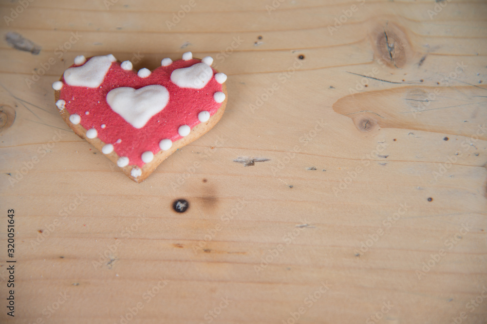 heart shaped gingerbread on a wooden table heart shaped gingerbread on a wooden table