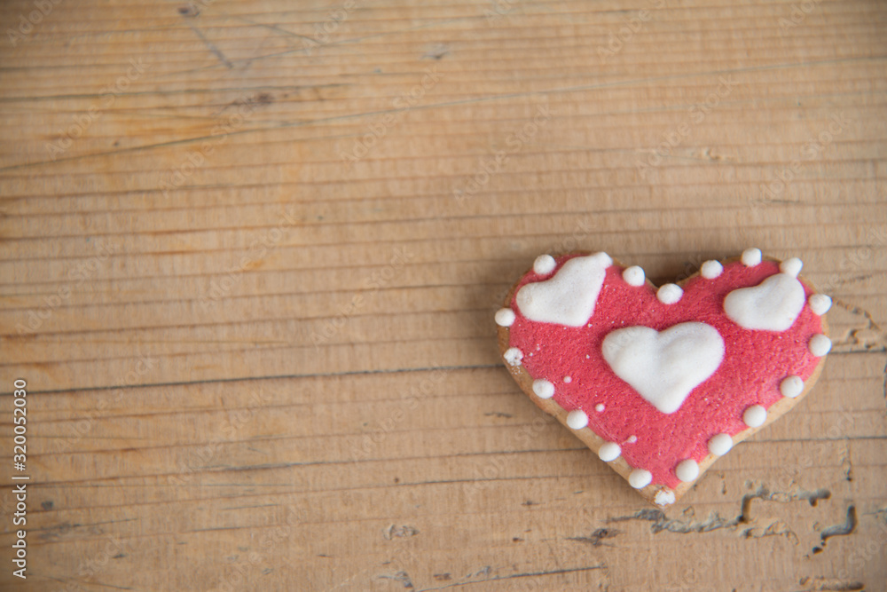 heart shaped gingerbread on a wooden table heart shaped gingerbread on a wooden table