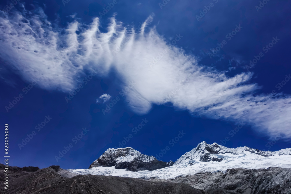 Clouds above snowy Huascaran mountains, Huaraz, Peruvian Andes Clouds above snowy Huascaran mountains, Huaraz, Peruvian Andes