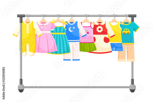 Clothes for infant babies, newborn children hanging on rack or rail