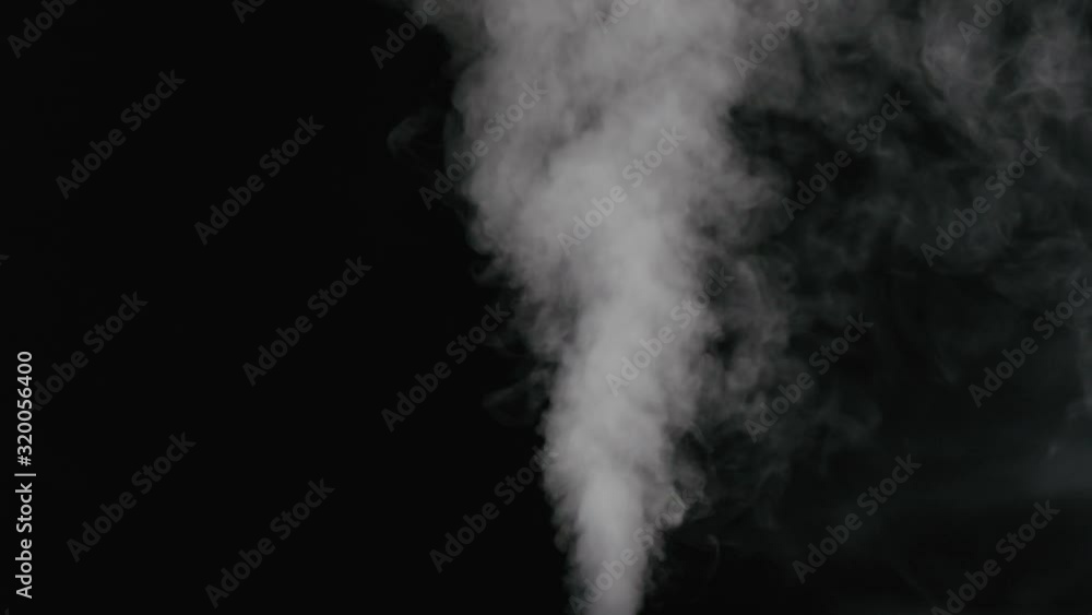Slow motion water mist stream with wind effect over black background Slow motion water mist stream with wind effect over black background
