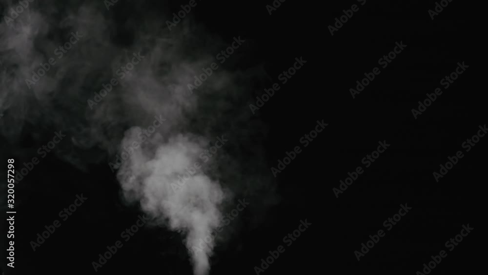 Slow motion water mist stream with wind effect over black background Slow motion water mist stream with wind effect over black background