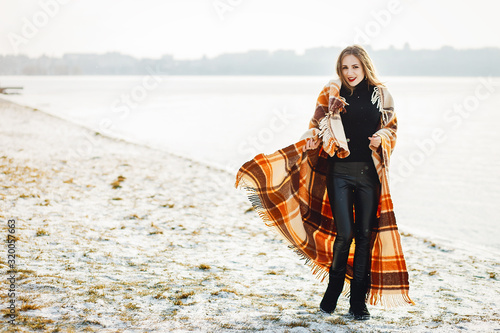 young and stylish four girls have fun in a winter park