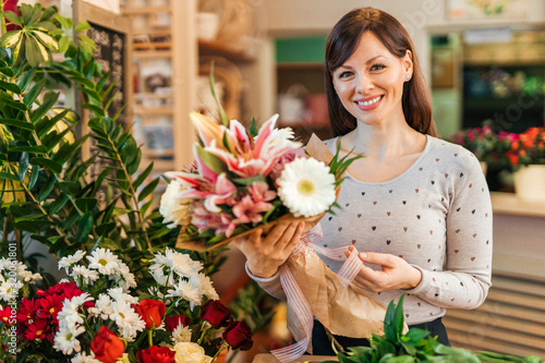 Portrait of a charming florist at work.