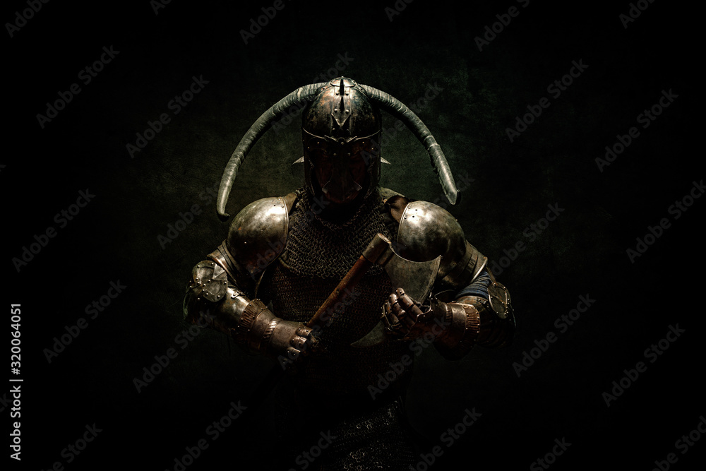 Portrait of a Viking Berserker warrior, holding an ax in his hands