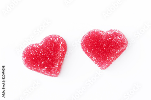 Red heart-shaped marmalade isolated on a white background. Concept valentine's day food, love. Copy space