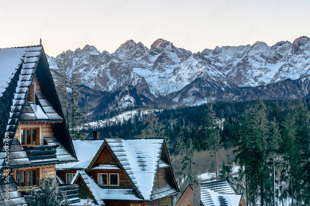 Winter in Tatra Mountains. Views on peeks across mountain houses Winter in Tatra Mountains. Views on peeks across mountain houses