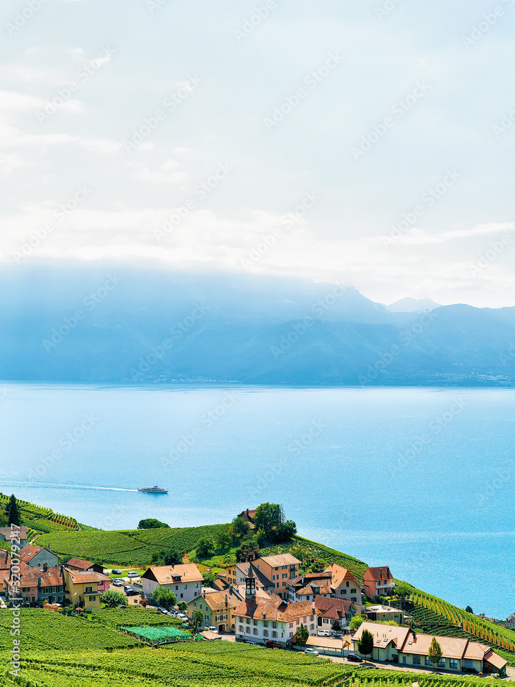 Fototapeta premium Lavaux Vineyard Terrace hiking route and ship on Lake Geneva and Swiss mountains, Lavaux-Oron district of Swiss