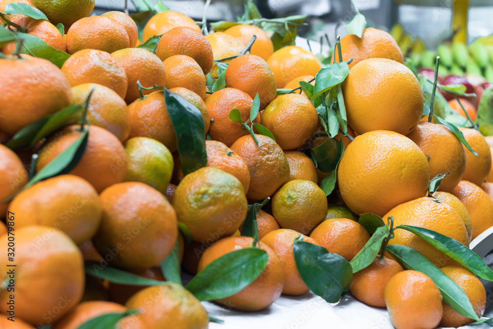 fresh mandarins on the counter at the market place