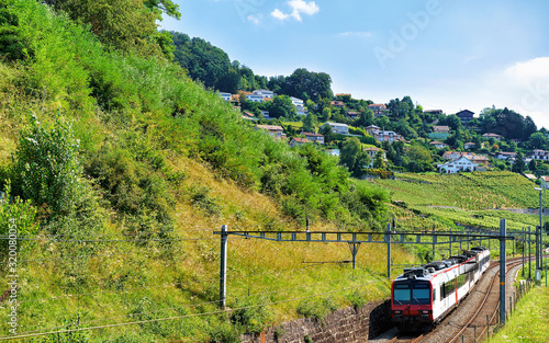 Running train at Lavaux Vineyard Terraces hiking trail, Lavaux-Oron district in Swiss photo