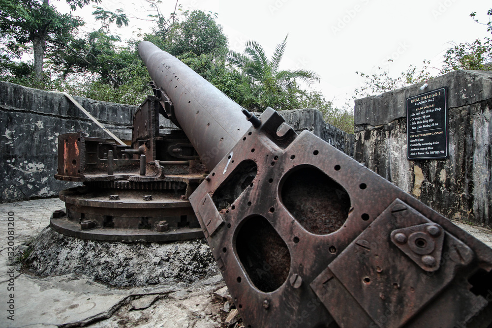 Wide-angle shot of the cannon located in the Fort at the highest point of the island of Cat BA. This weapon was used during the Vietnam war in the Northern Vietnam.