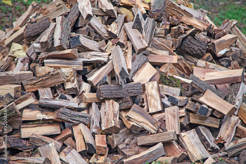 Natural background with huge pile of firewoods Natural background with huge pile of firewoods