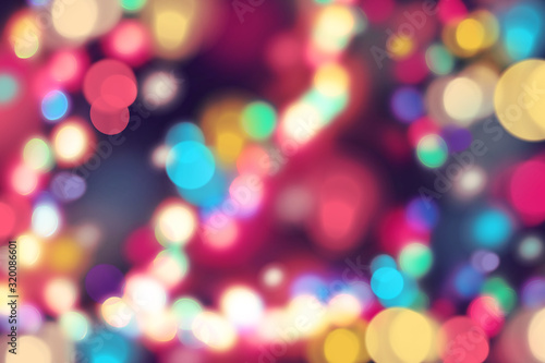 Abstract background with evening lights Many colorful light spots with bokeh effect on black background