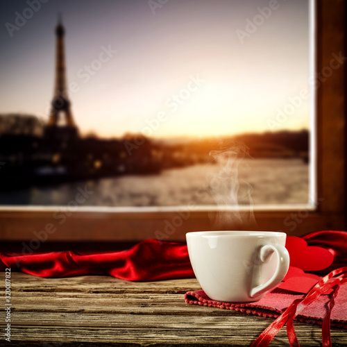 Valentine s Day coffee on window sill and city landscape of Paris . 
