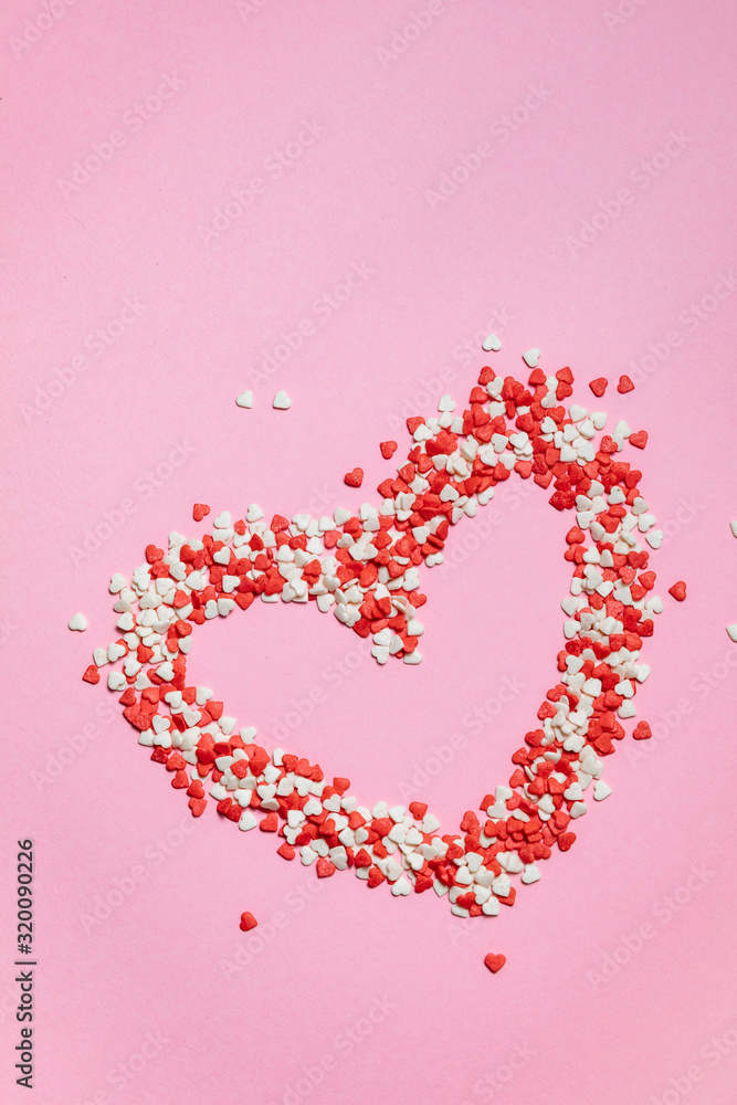 Colorful Valentines Day hearts  on pink background