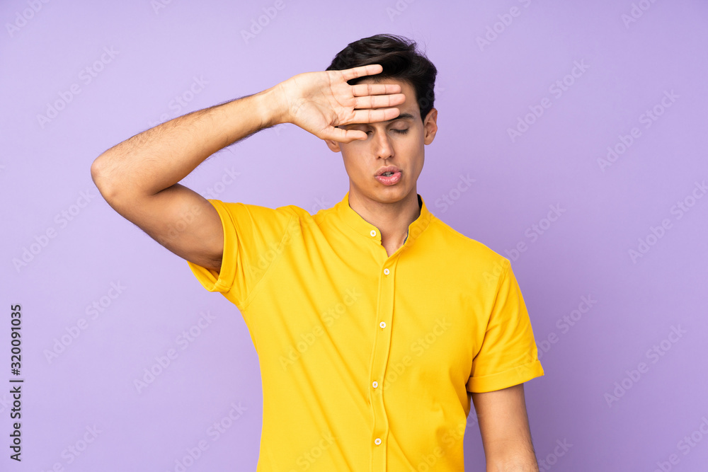 Man over isolated purple background with tired and sick expression Man over isolated purple background with tired and sick expression