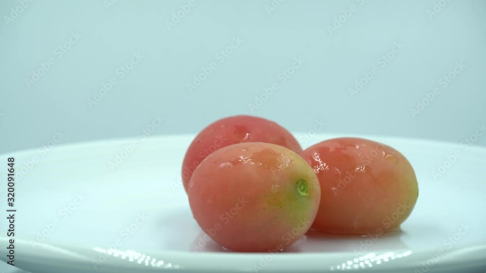 tomatoes white background with water drop. tomato is a very popular fruit/vegetable. tomatoes white background with water drop. tomato is a very popular fruit/vegetable.
