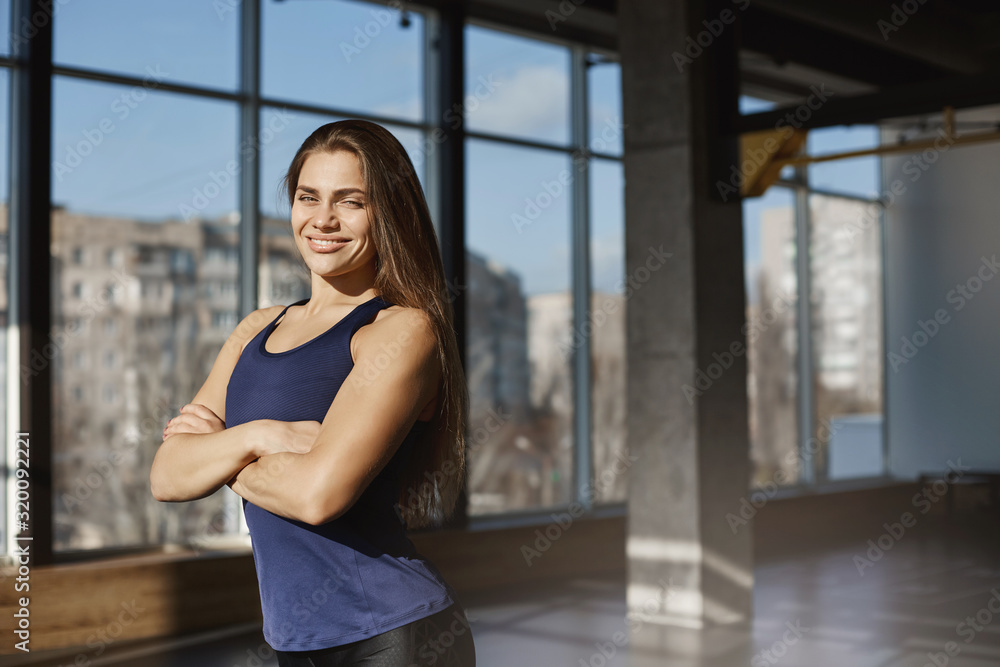 Sport and active lifestyle concept. Confident and healthy, active young energized athletic sportswoman in activewear, cross arms over chest, invite join gym, buy membership in fitness club, smiling Sport and active lifestyle concept. Confident and healthy, active young energized athletic sportswoman in activewear, cross arms over chest, invite join gym, buy membership in fitness club, smiling