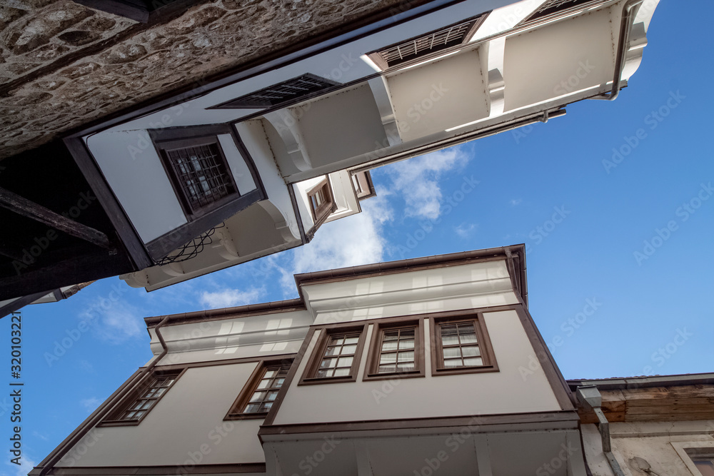 The architecture of the old town. Part of Renaissance houses. Looking up. Ohrid, Northern Macedonia.