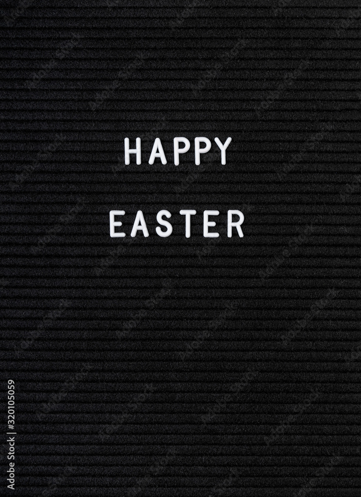 The words Happy Easter on black felt letter board The words Happy Easter on black felt letter board