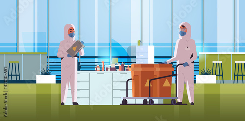 scientists in protective hazmat suits carrying barrels with warning sign 2019-nCoV flu outbreak china pathogen respiratory MERS-CoV quarantine coronavirus concept laboratory interior horizontal vector