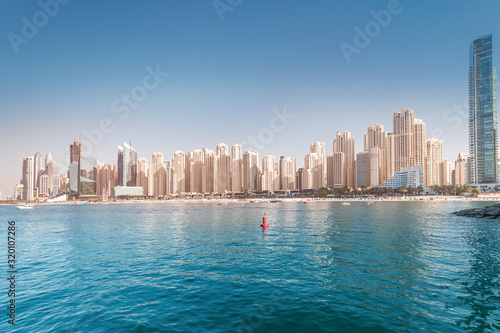 Numerous skyscrapers residential buildings and apartments and hotels on the Persian Gulf in Dubai. Real estate concept