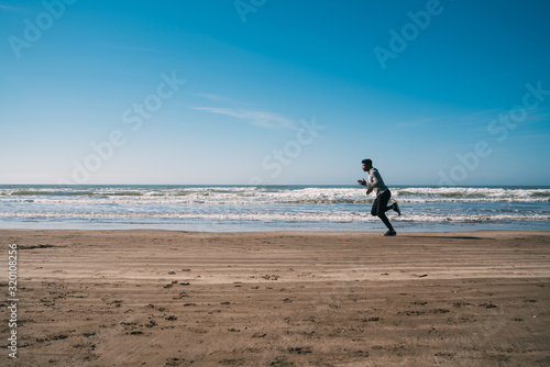 Portrait of an athletic man running.