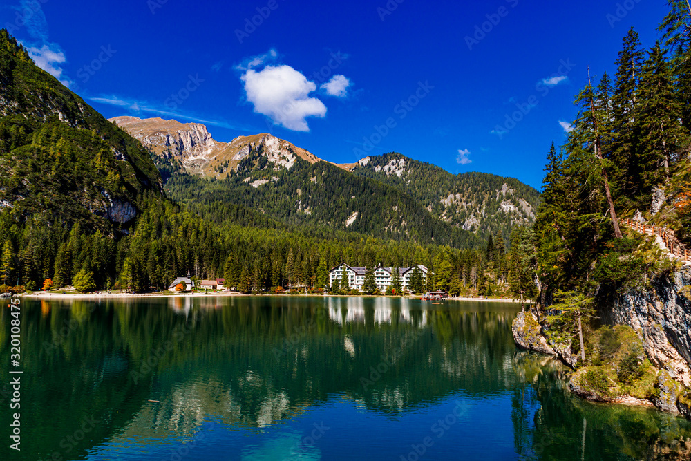 Lake Braies (also known as Pragser Wildsee or Lago di Braies) in Dolomites Mountains, Sudtirol, Italy. Romantic place with typical.