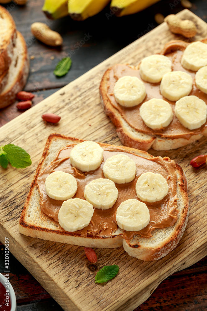 Peanut Butter and banana Sandwich on wooden board. morning breakfast Peanut Butter and banana Sandwich on wooden board. morning breakfast