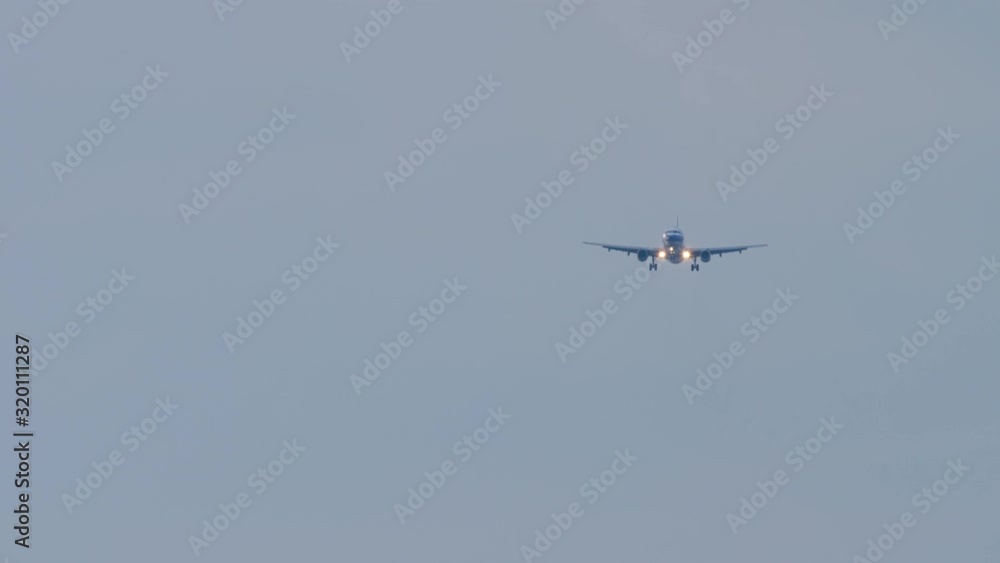 Airplane approaching over ocean Airplane approaching over ocean