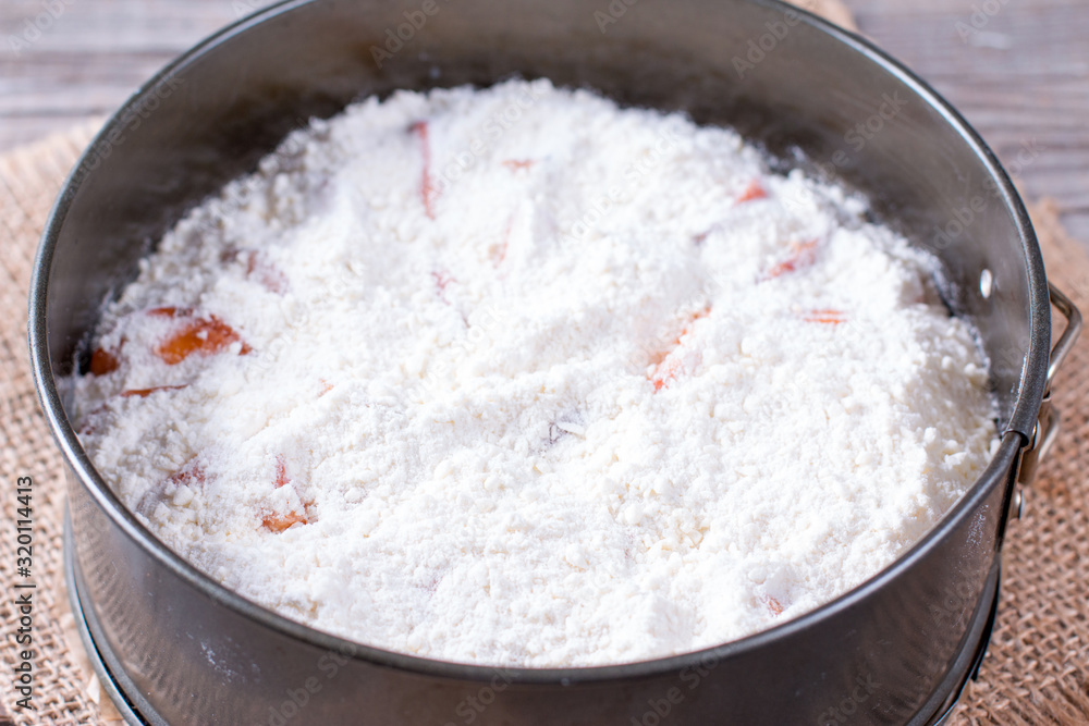 Flour and sugar in a baking dish Flour and sugar in a baking dish