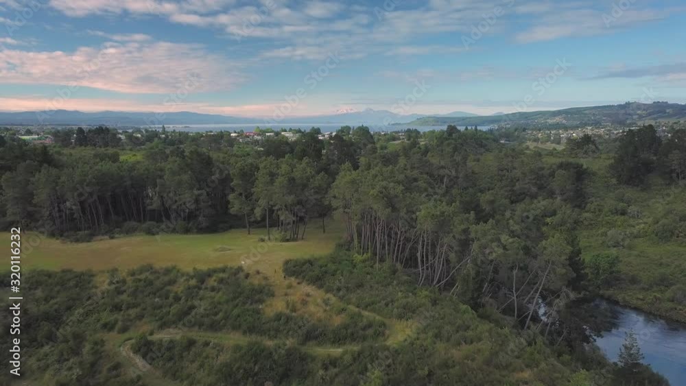 Flyover of the Waikato River and trees in Taupo, New Zealand Flyover of the Waikato River and trees in Taupo, New Zealand