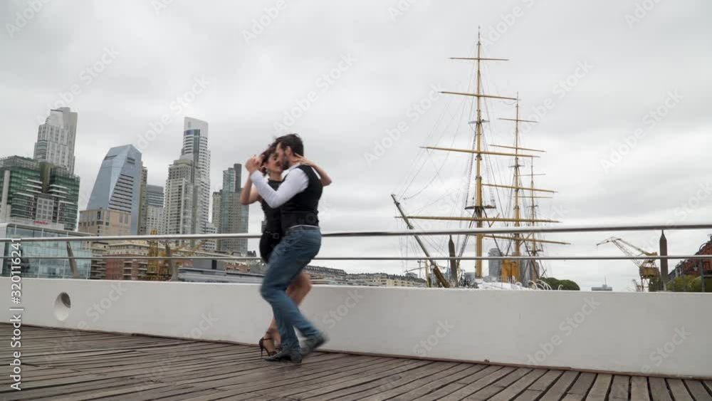 A couple of tango dancers dancing in famous locations of Buenos Aires A couple of tango dancers dancing in famous locations of Buenos Aires