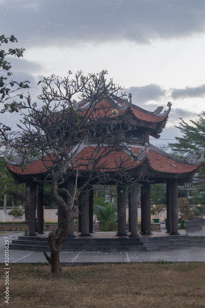 small Asian temple in the thickets of tropical plants small Asian temple in the thickets of tropical plants
