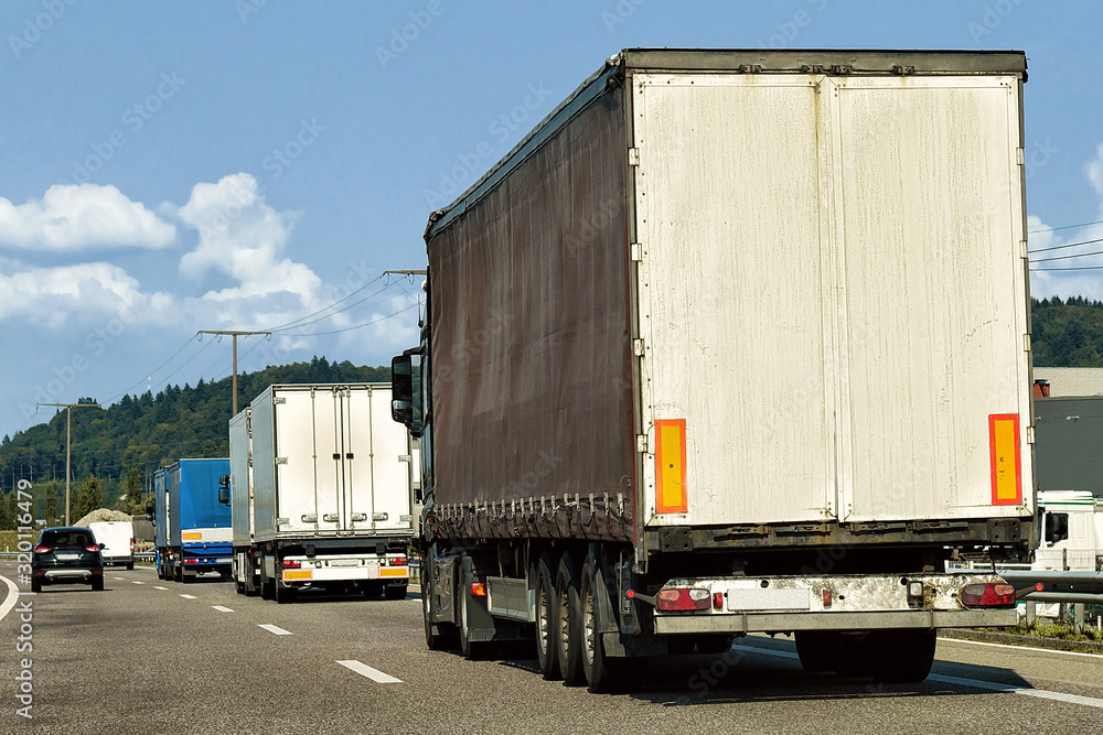 Trucks on the roadway in Canton Geneva in Switzerland.