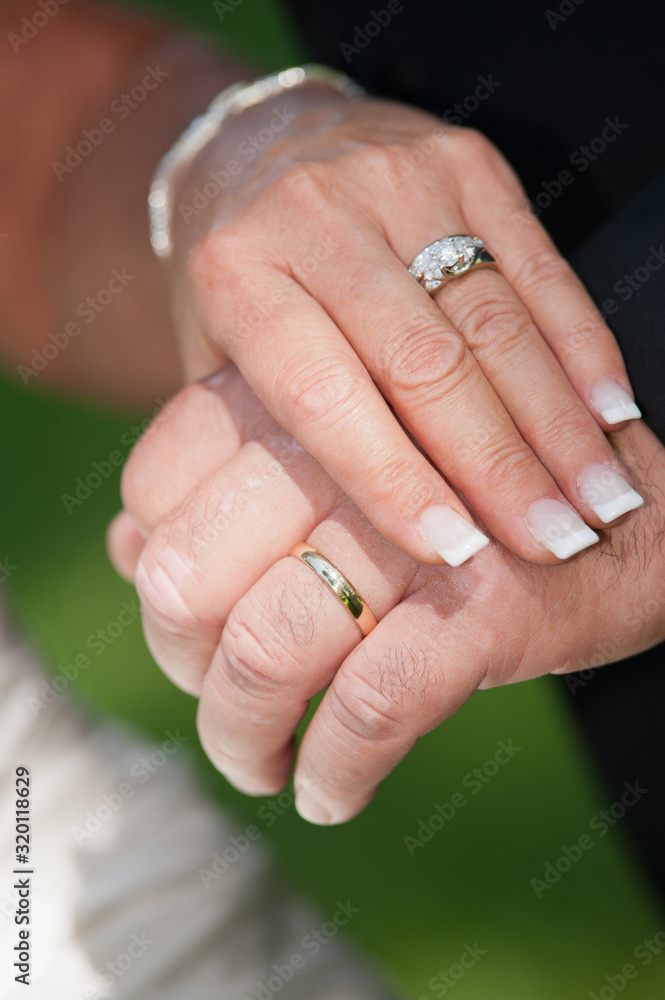 Wedding rings on bride and groom