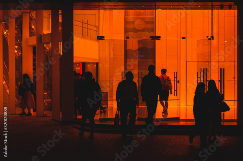 Photography people leaving office building, silhouettes of  people