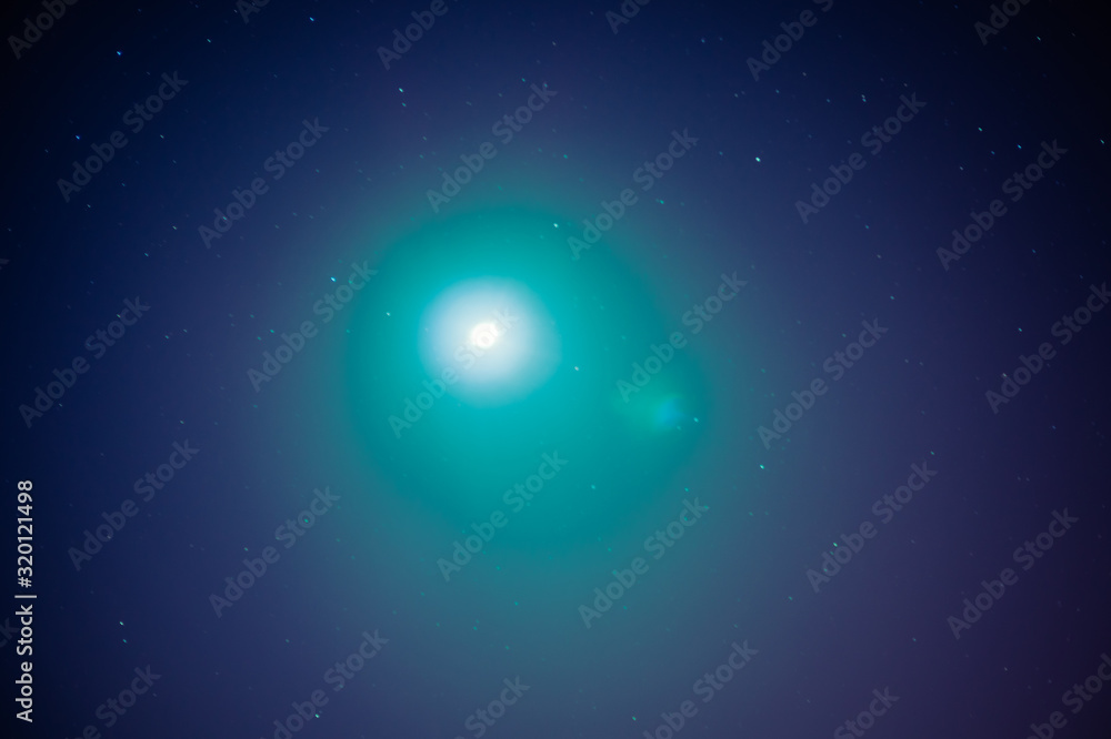 Glow of the moon with glare and night astrological sky. Glow of the moon with glare and night astrological sky.