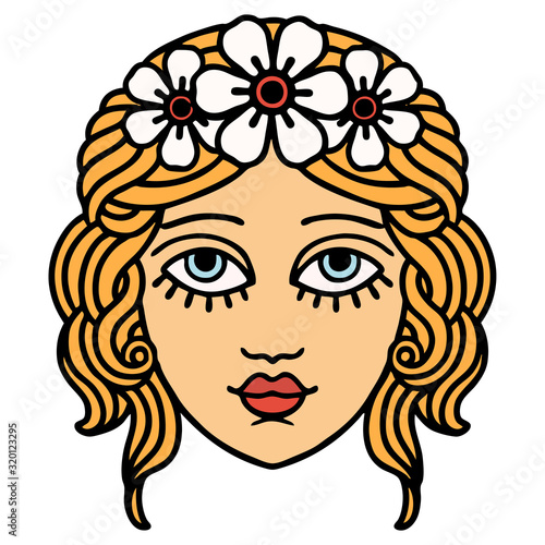 traditional tattoo of female face with crown of flowers